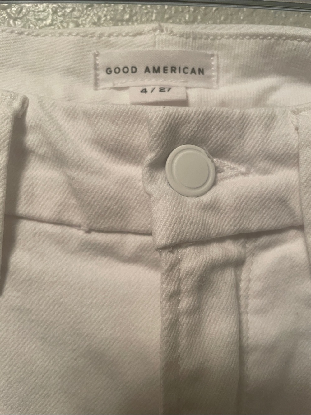 Good American white chalk colored jeans